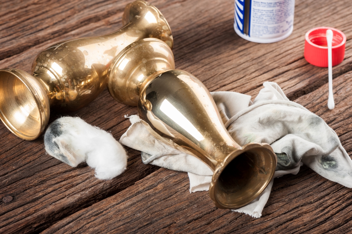 Brass items being cleaned on wooden table