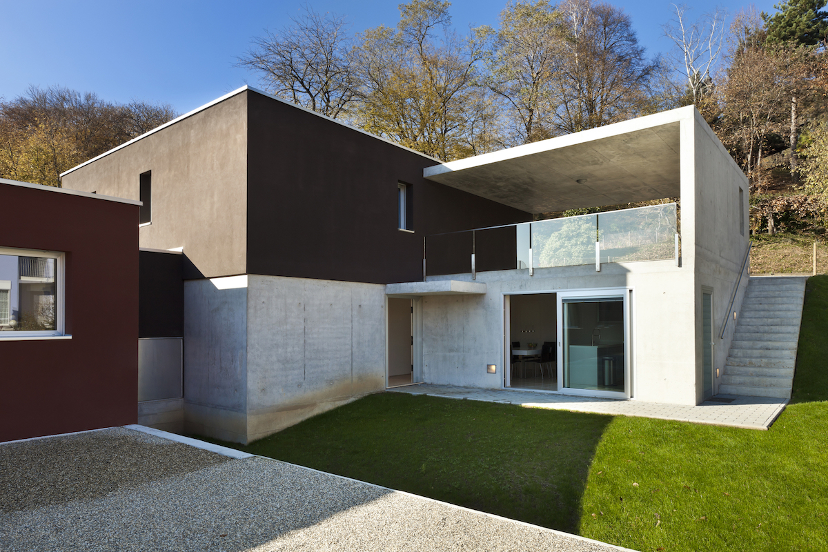 The exterior of a modern home is made of concrete.