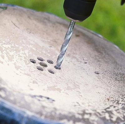 Drilling drainage holes in container pots