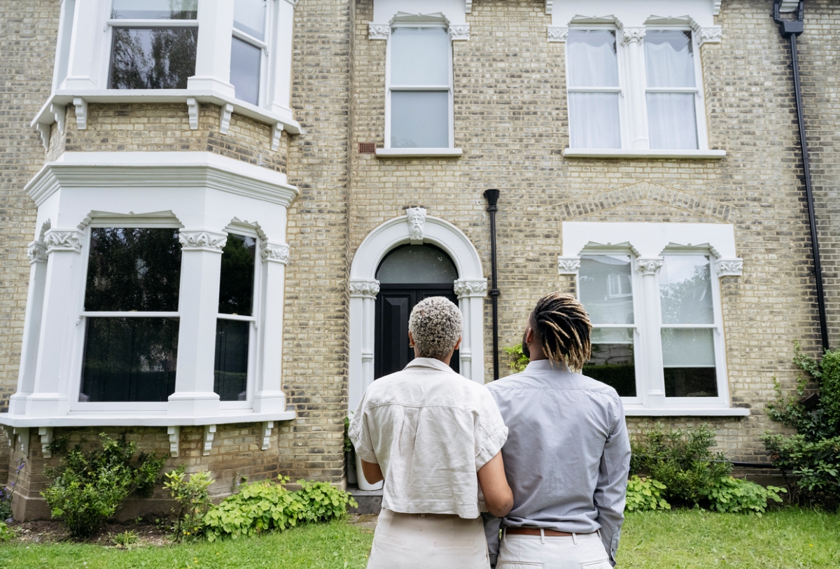 When Remodeling an Old House, What Should You Keep - couple looking at victorian home