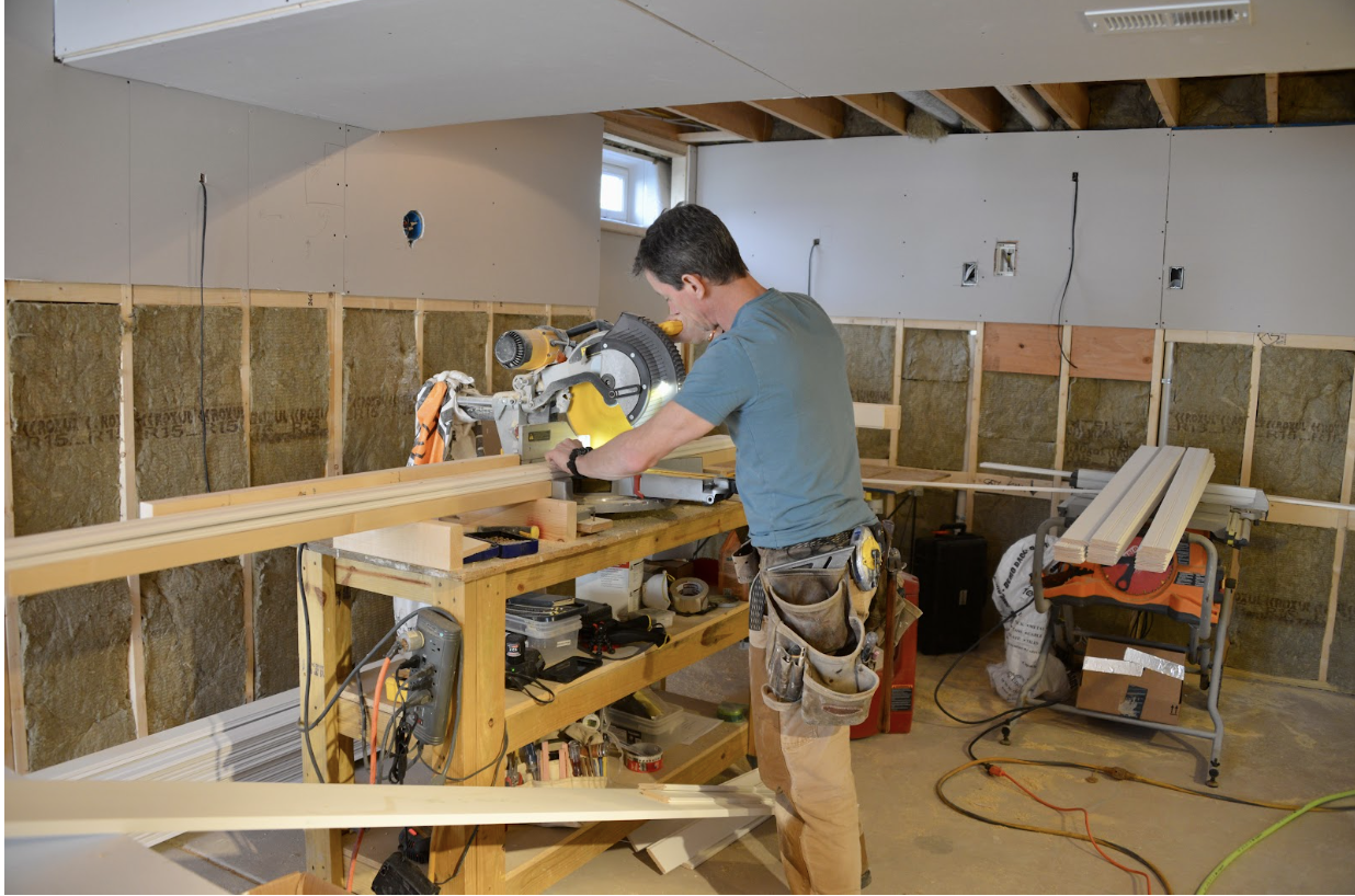 When installing beadboard as wainscoting, make sure there’s adequate space nearby to set up tools. Here, Mark is trimming boards to length.