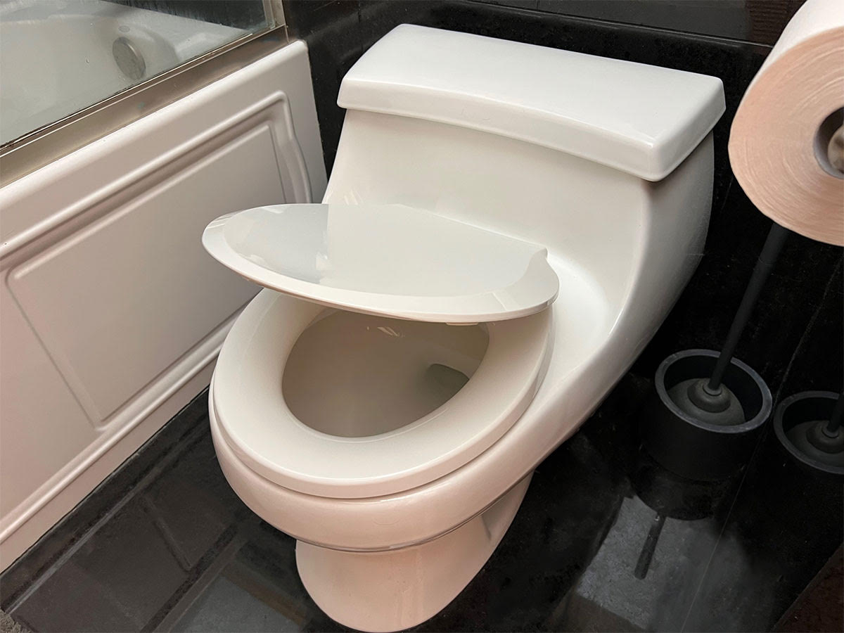 Toilet seat half open