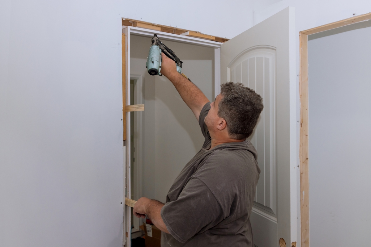 How to Install a Prehung Door - nailing top door jamb