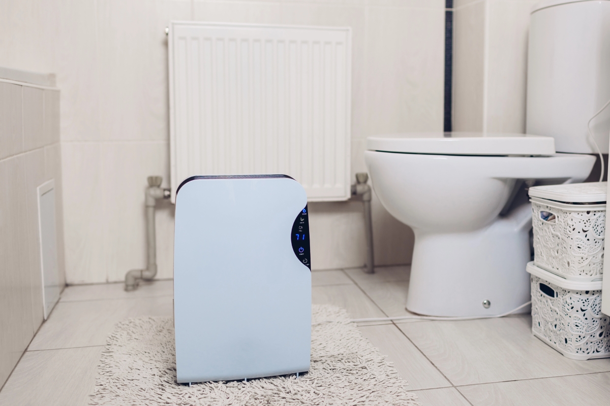 A dehumidifier is used in the bathroom.