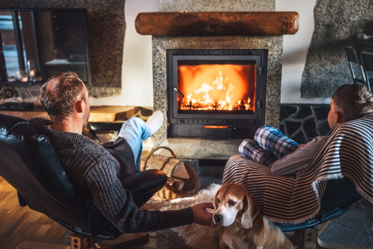 iStock-1170305301 diy fire starter couple and dog enjoying fire.jpg