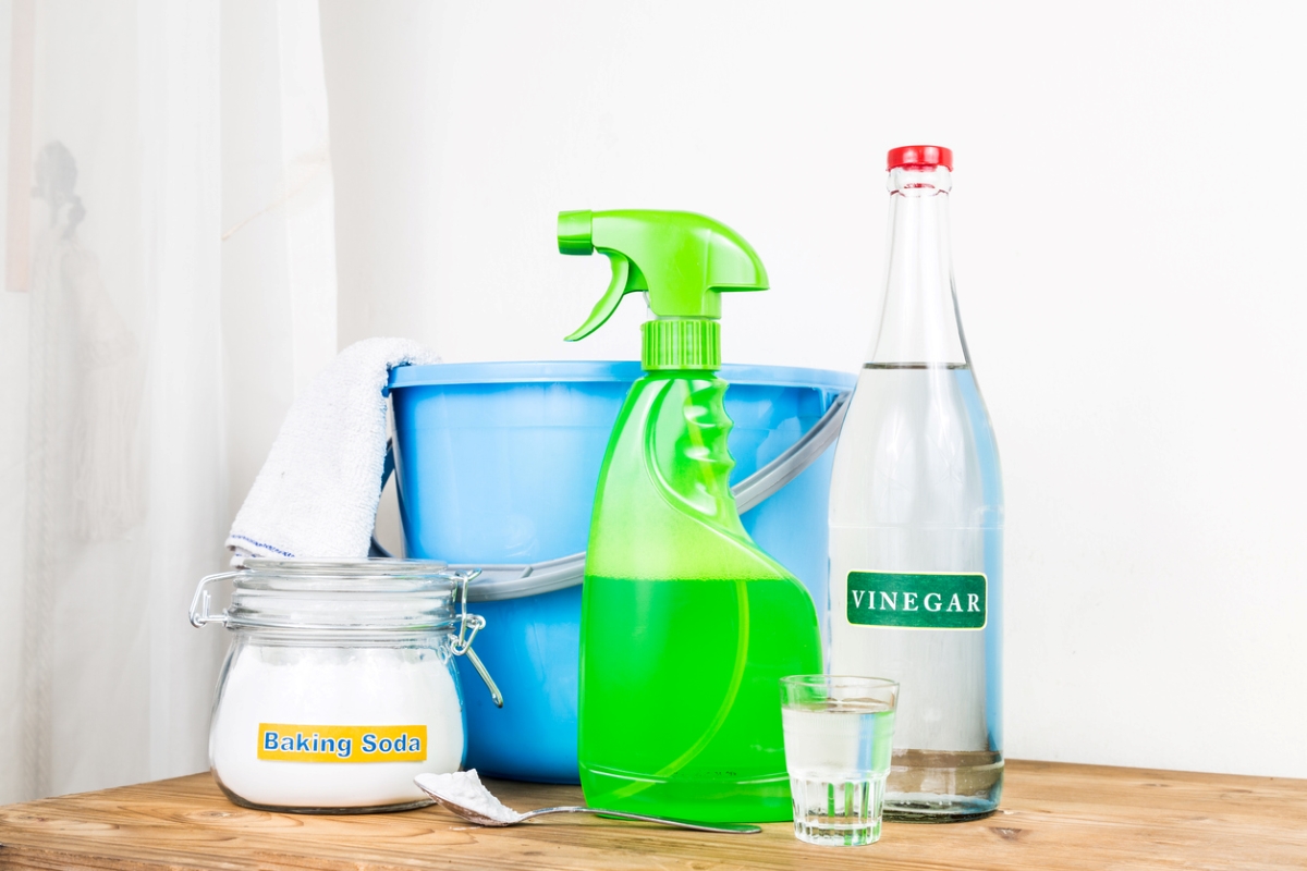 Home cleaning supplies, including a bucket and spray bottle.