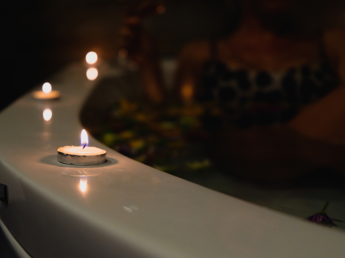 a hot tub and burning candles