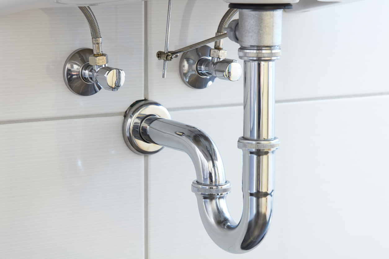 Bathroom sink with stainless steel p-trap.