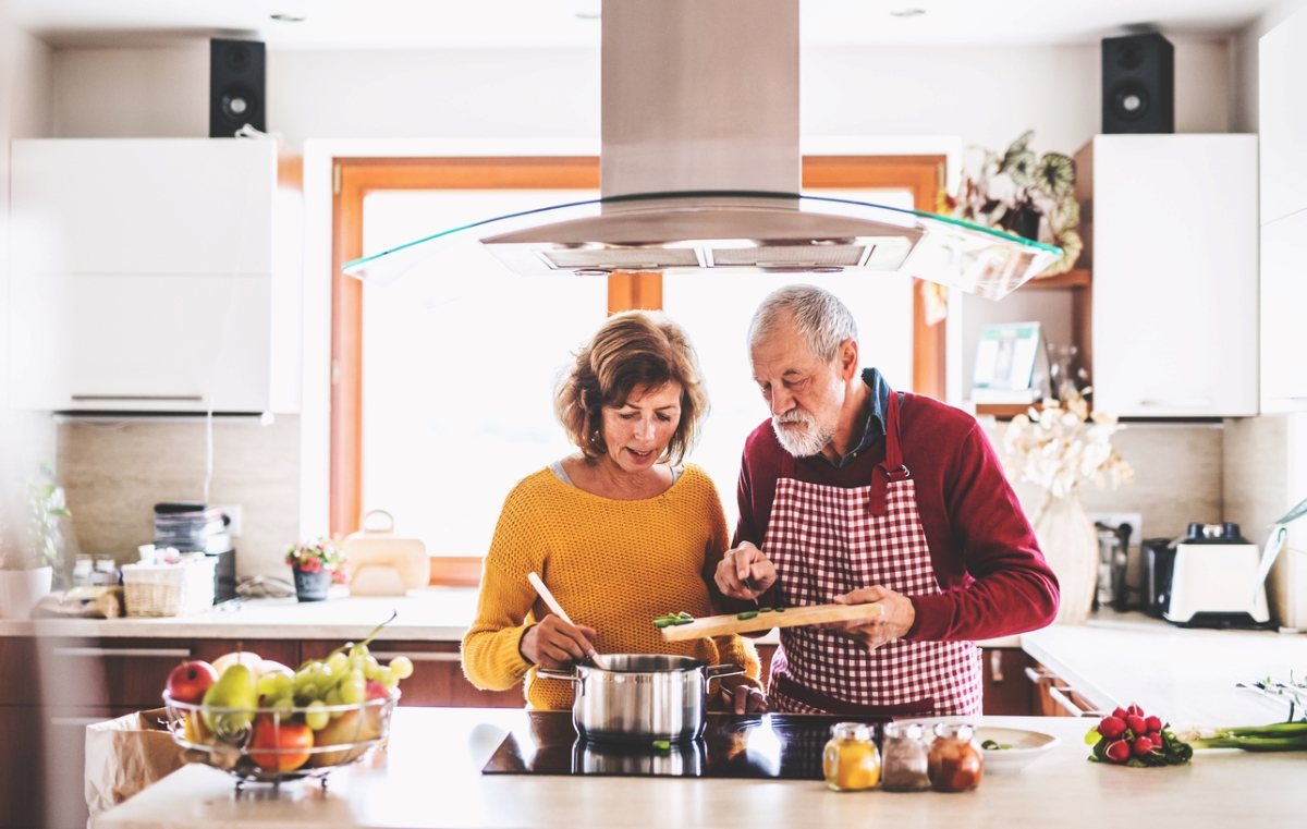 Couple cooking in kitchen