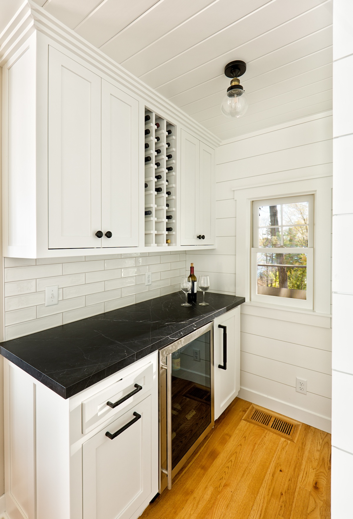 A black quartz countertop in a kitchen.