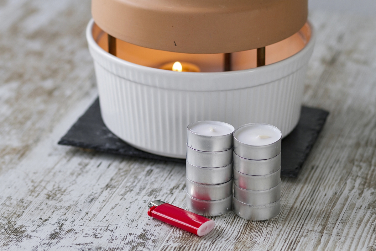 A terracotta pot placed over candles to use as a heater