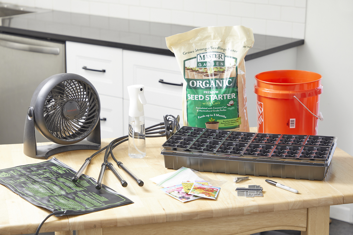 Materials needed for starting seeds inside, including soil and a fan.