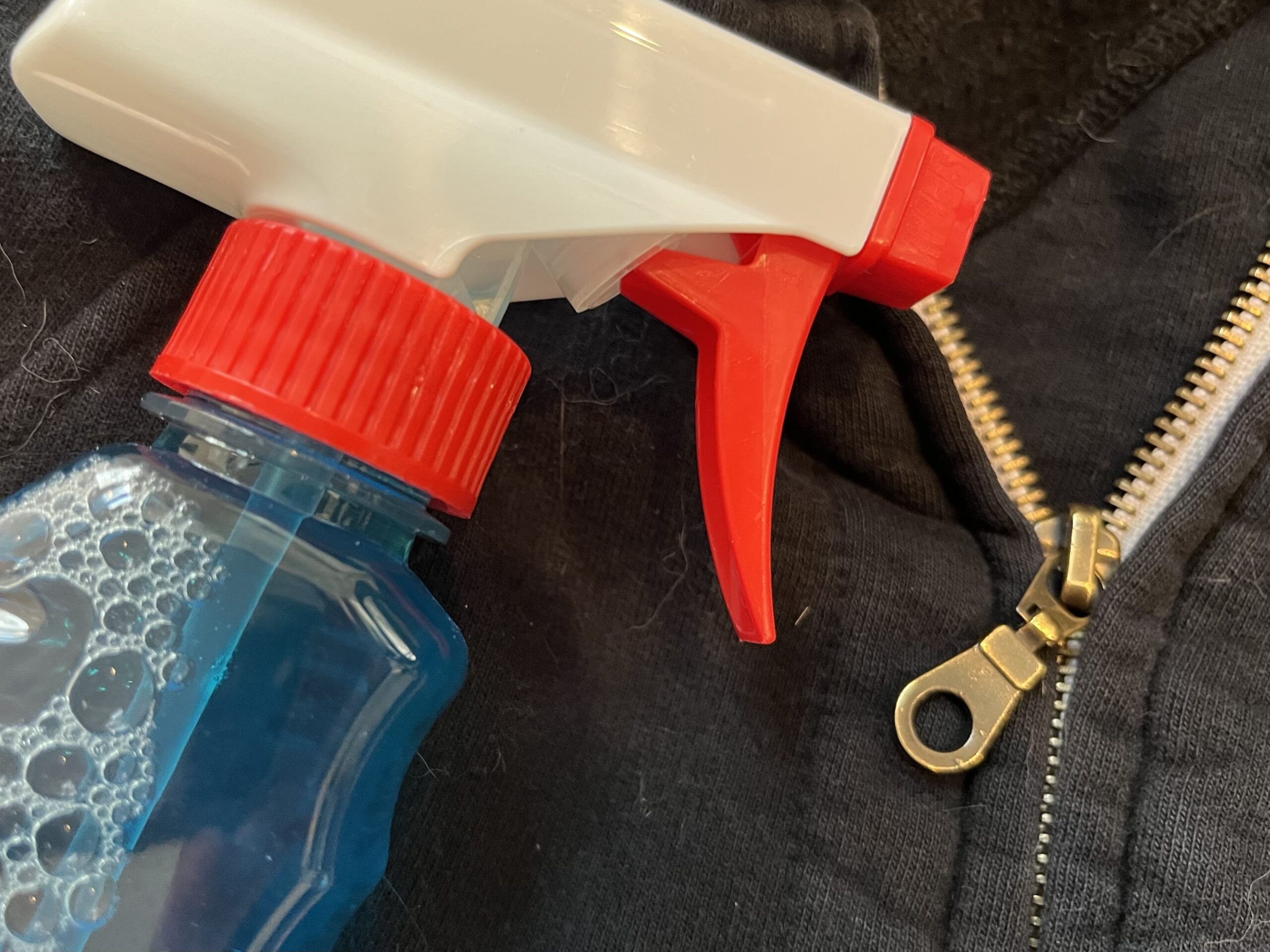 Using Windex on a sweatshirt's stuck zipper