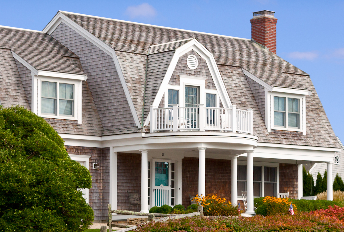 Chatham, MA, USA - Shingle house in New England with gambrel dormer and beautiful landscaping.