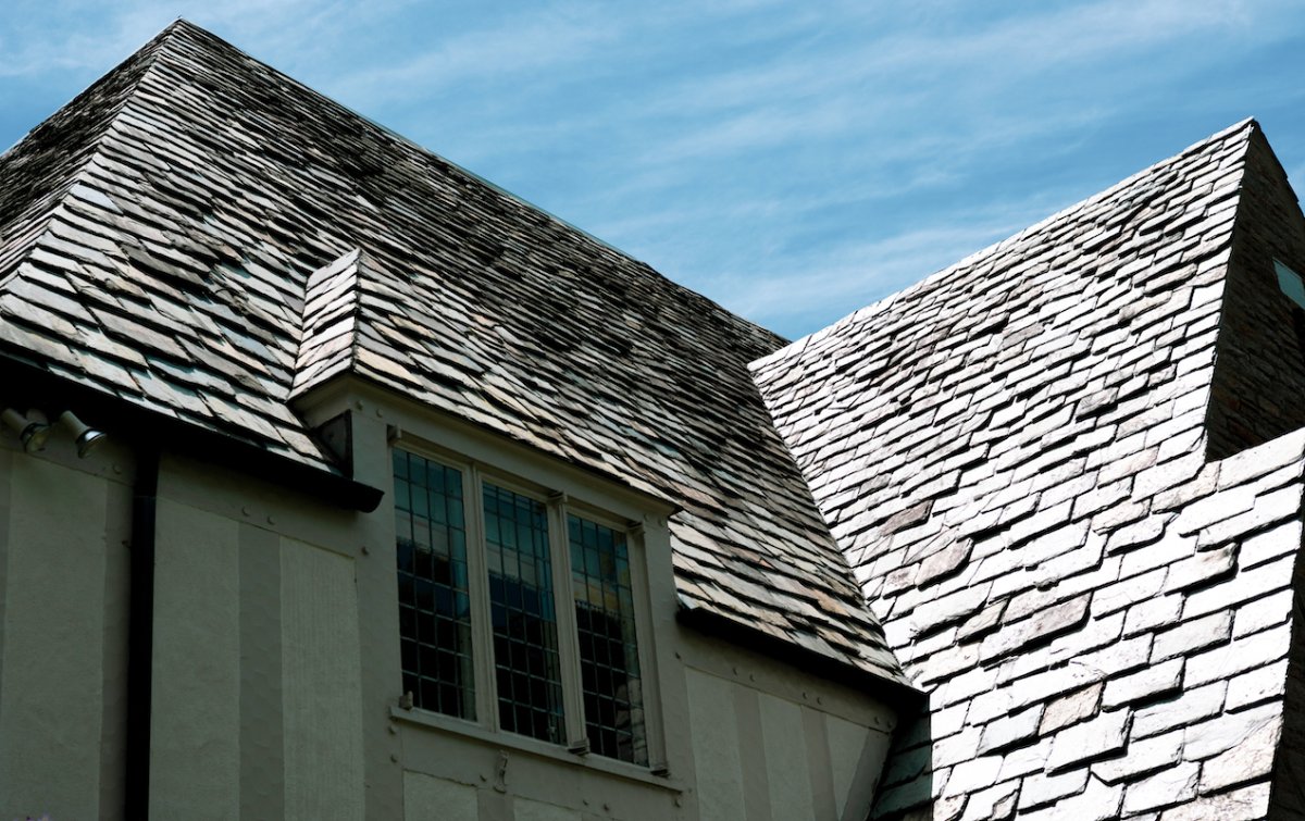 A slate-roofed house with a wall dormer.