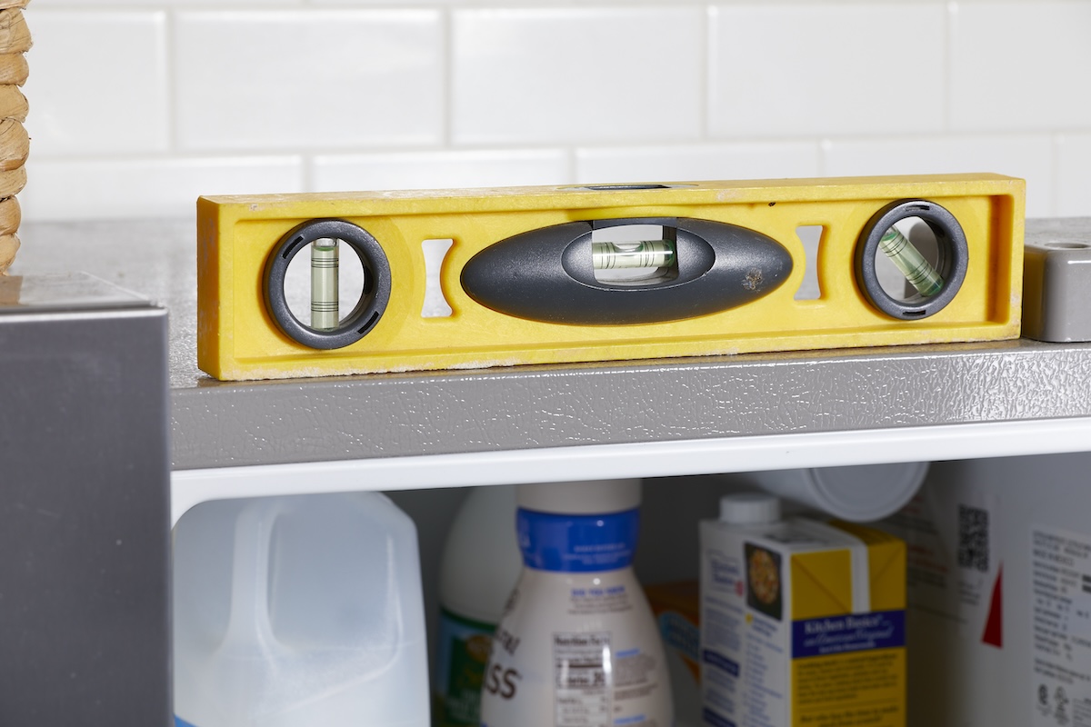 A yellow level on a refrigerator.