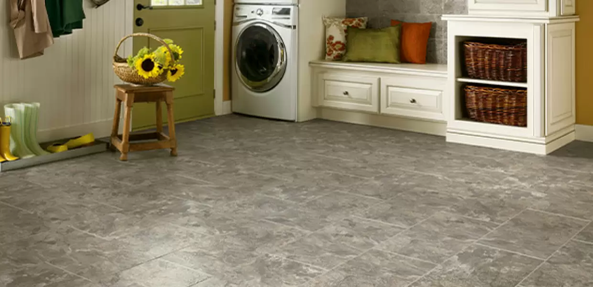 Gray tile flooring in laundry room.