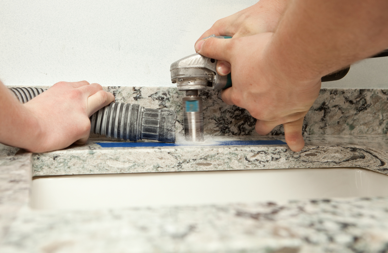 Workers Cut New Countertop for Faucet