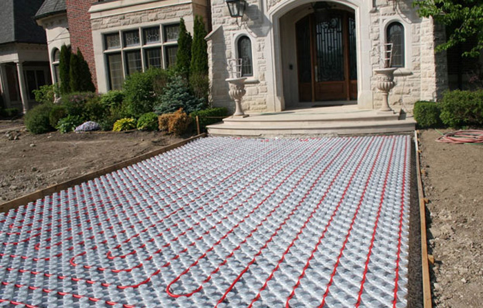 Hydronic driveway heating system being install.