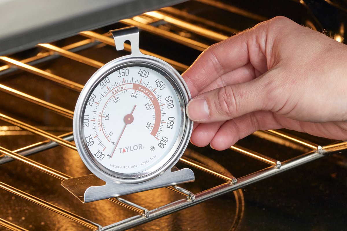 Close up of a thermometer inside an oven.