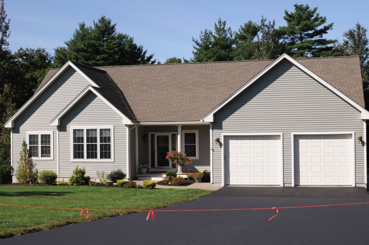 A photo of a house where the best driveway sealer option has been used to reseal the driveway