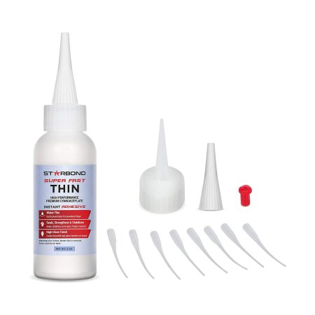  Bottle of Starbond EM-02 Super Fast Thin CA Glue next to multiple tops on a white background