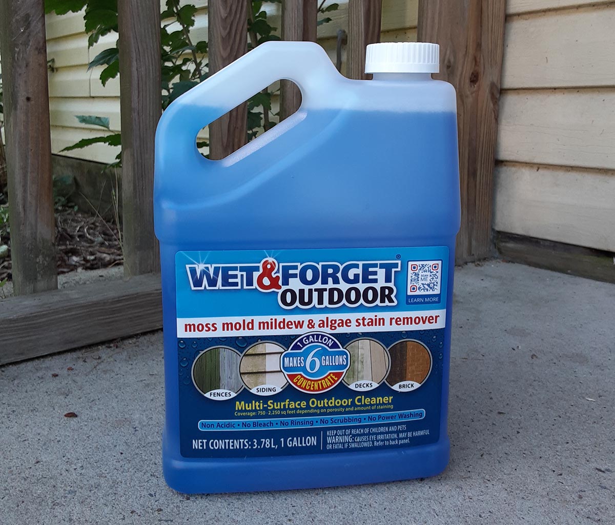 bottle of wet and forget outdoor cleaner on concrete porch