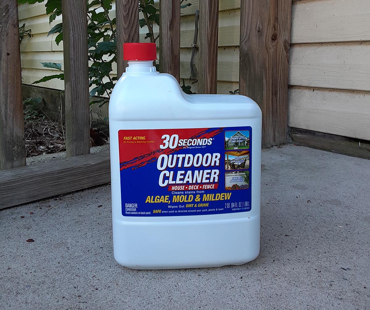 Bottle of 30 seconds outdoor cleaner on concrete porch