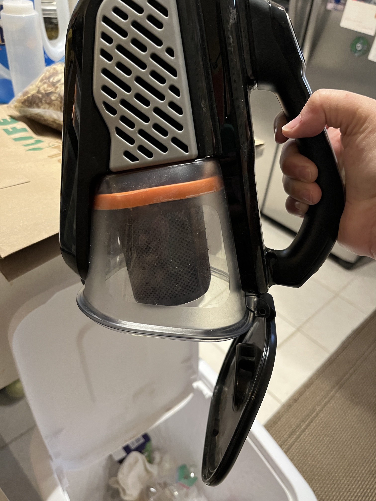 a hand holding one of the Best Handheld Vacuum Options