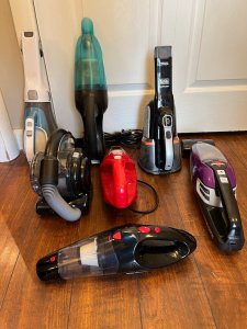 The Best Handheld Vacuum Options laid out on the floor inside a room