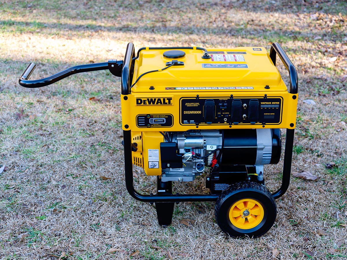 The DeWalt 8000-Watt Electric Start Gas Generator on grass during testing.