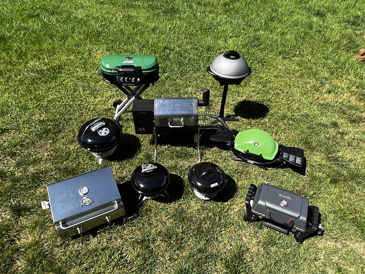 A group of the Best Portable Grills on a lawn before testing.