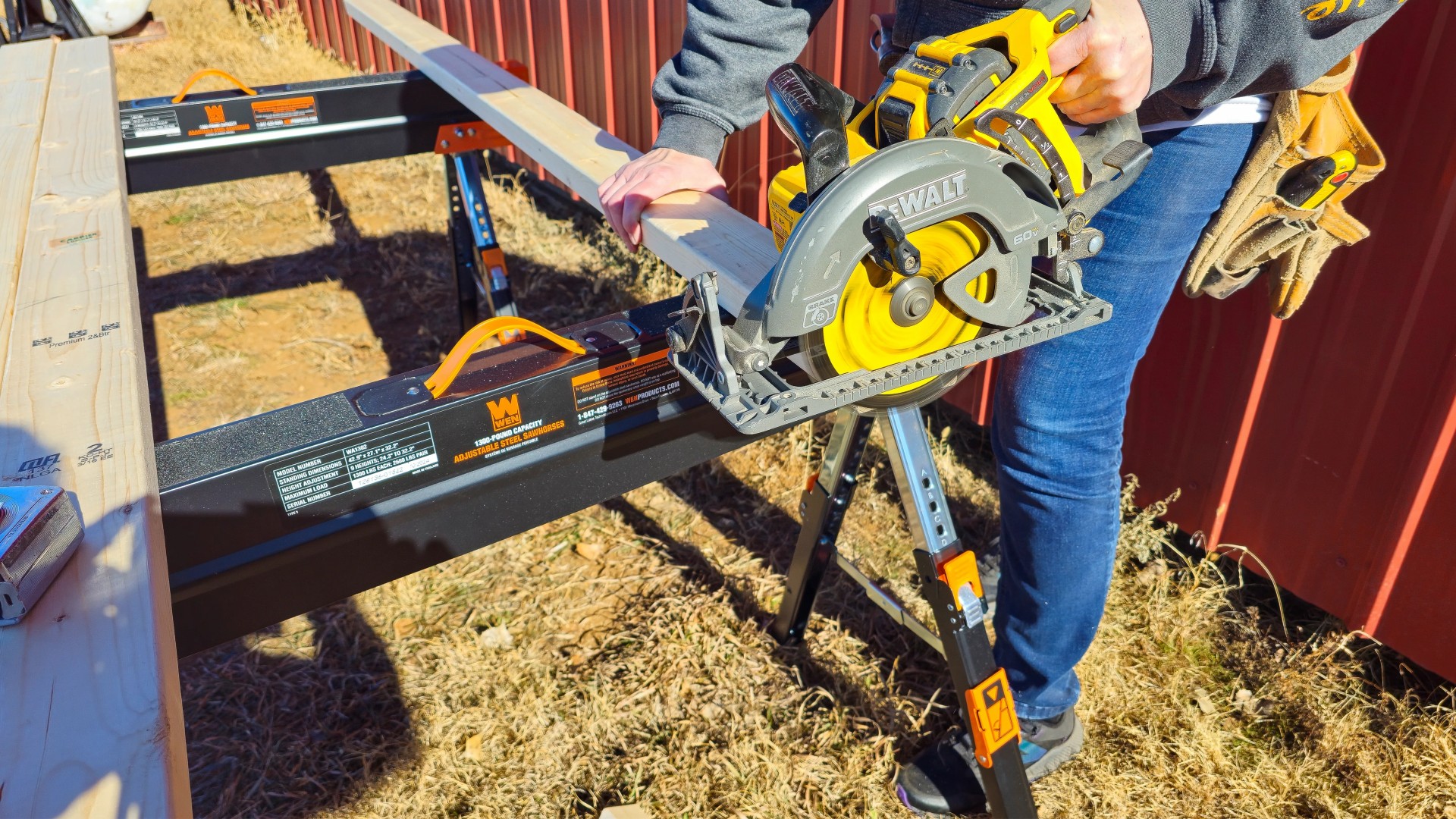 woman-cutting-wood-circular-saw-wen-sawhorses 