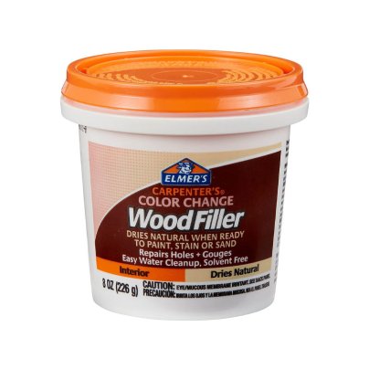 A bucket of Elmer’s E913 Carpenter’s Color Change Wood Filler on a white background.