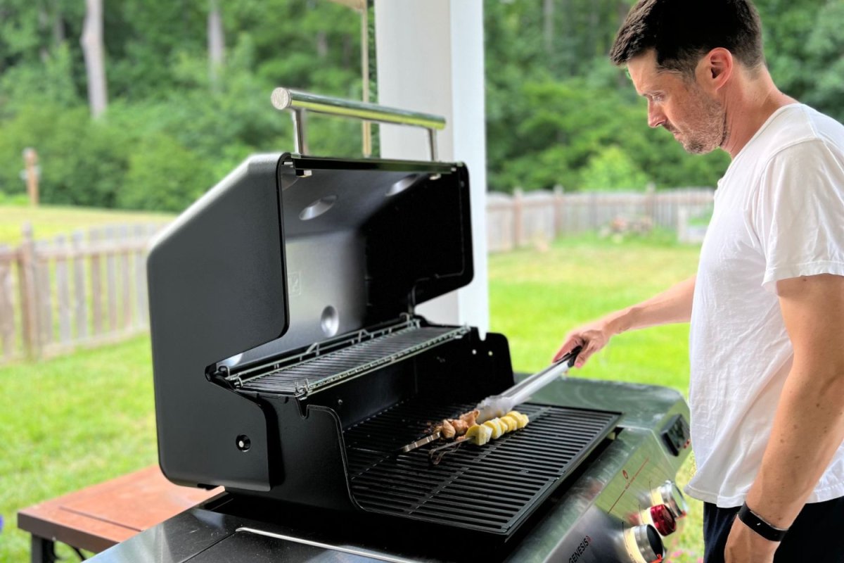 Man grilling skewers on Weber Genesis EPX-335