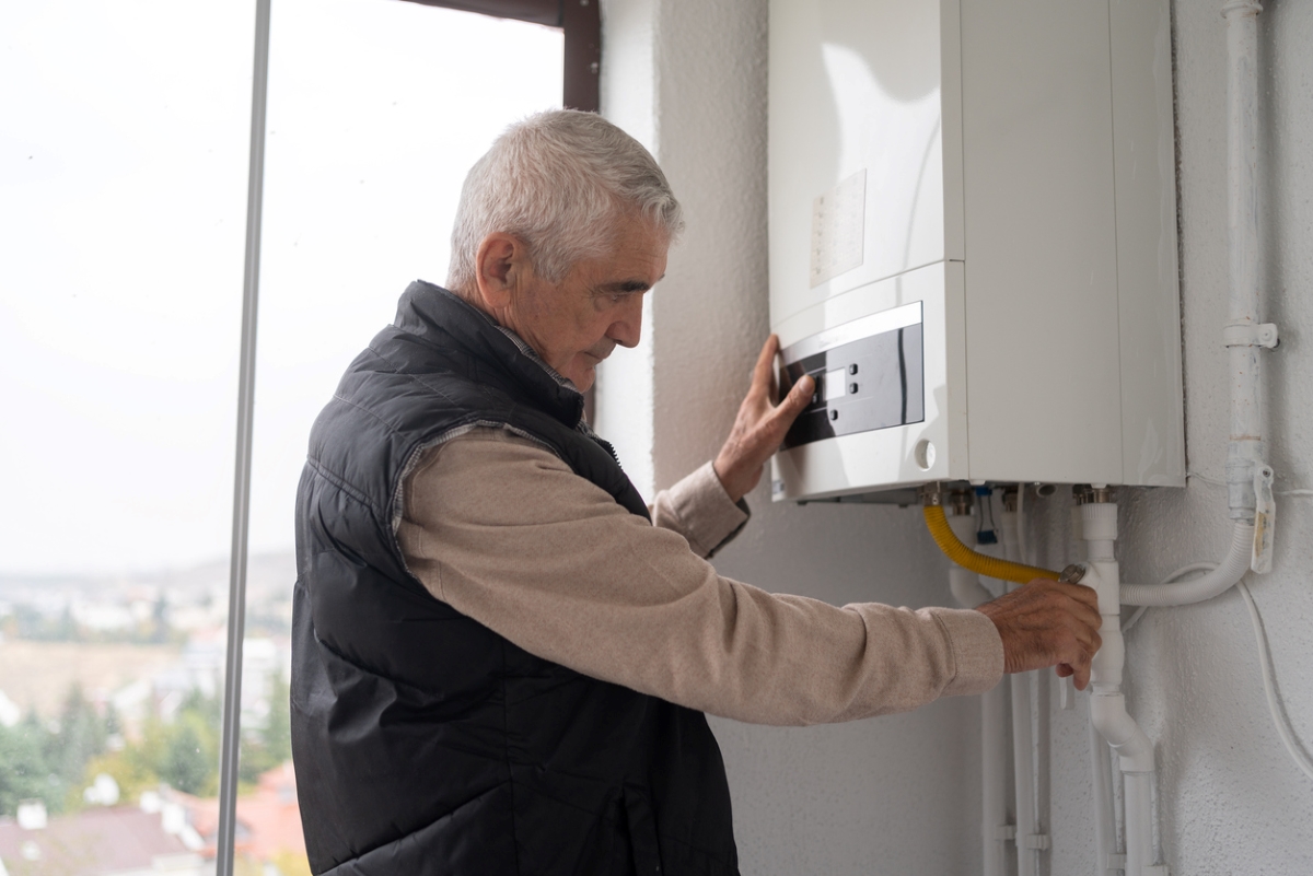 Senior turning off boiler.