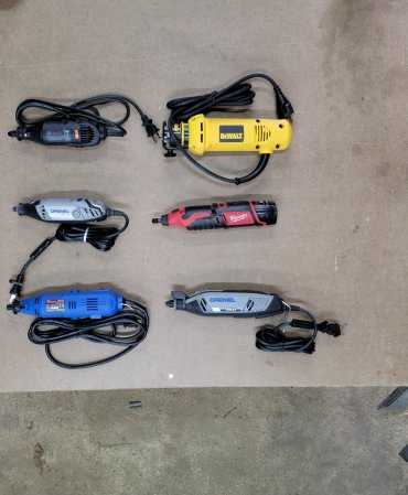 A group of the best rotary tool options on a work bench before testing.