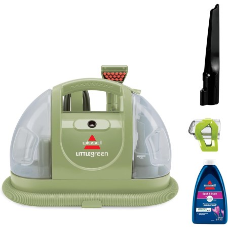  The Bissell Little Green Portable Carpet Cleaner and its accessories on a white background.