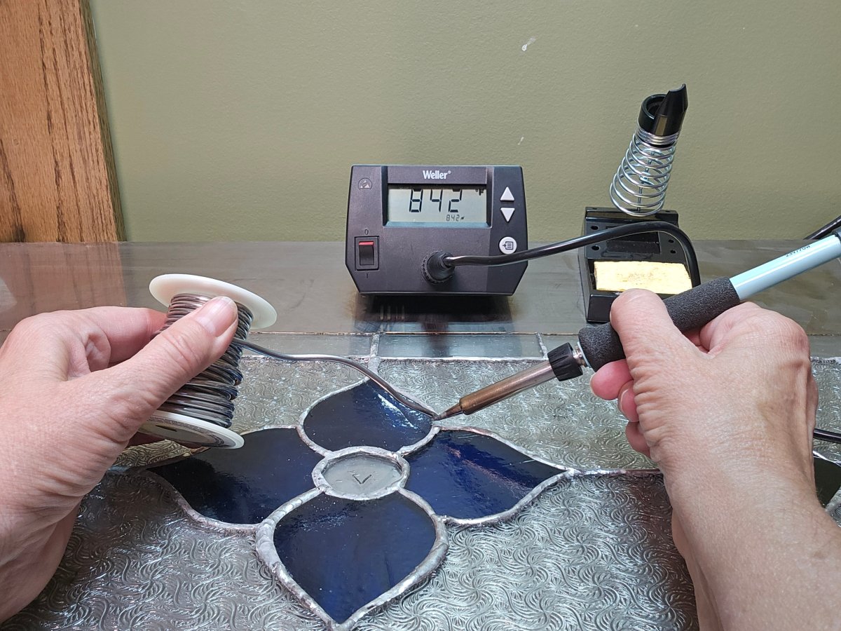 A man working with Weller Digital soldering station