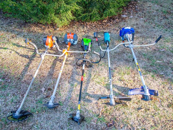 A group of the best brush cutters on grass before testing.