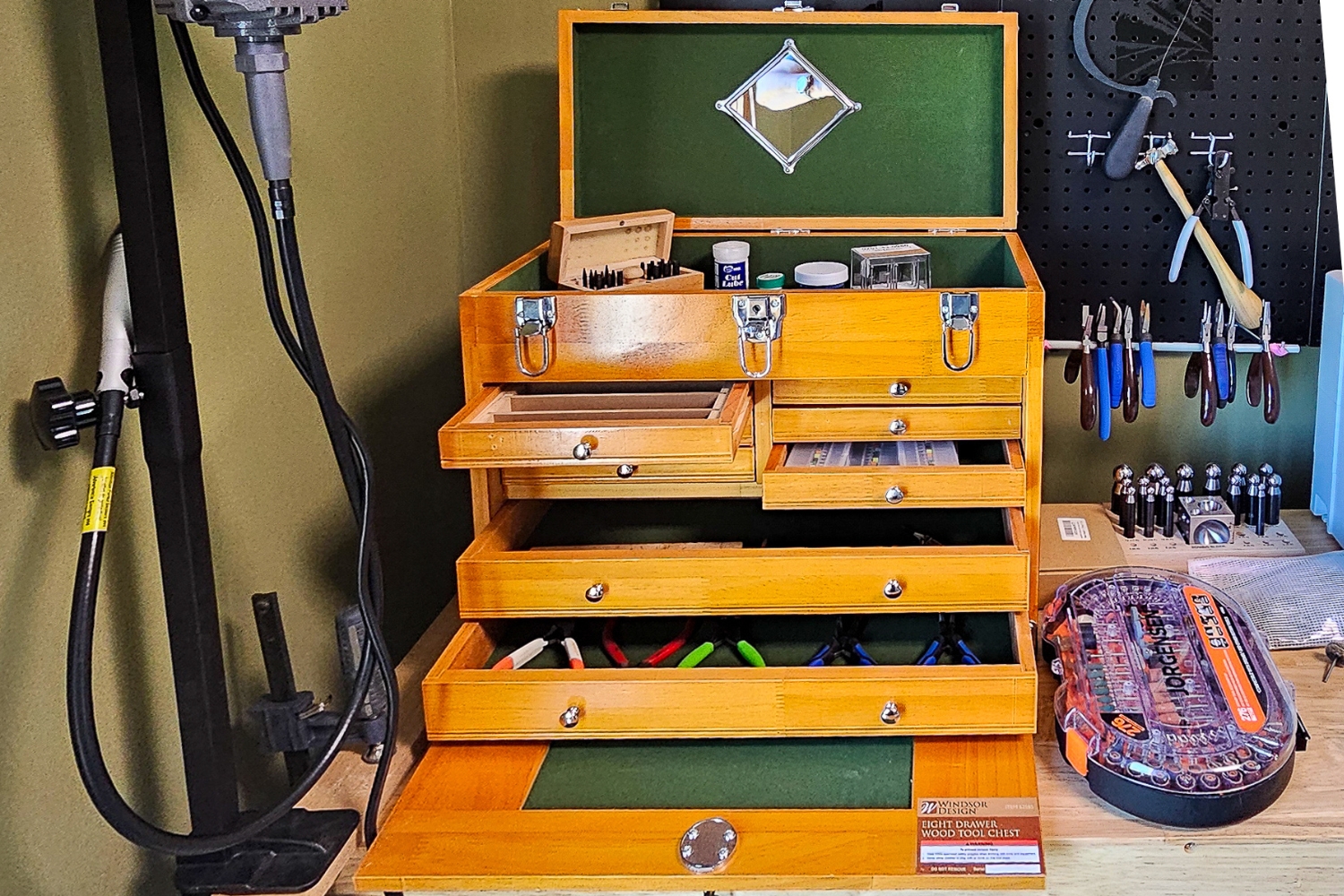 The Windsor Design 8-Drawer Wood Tool Chest on a workbench and filled with tools during testing.