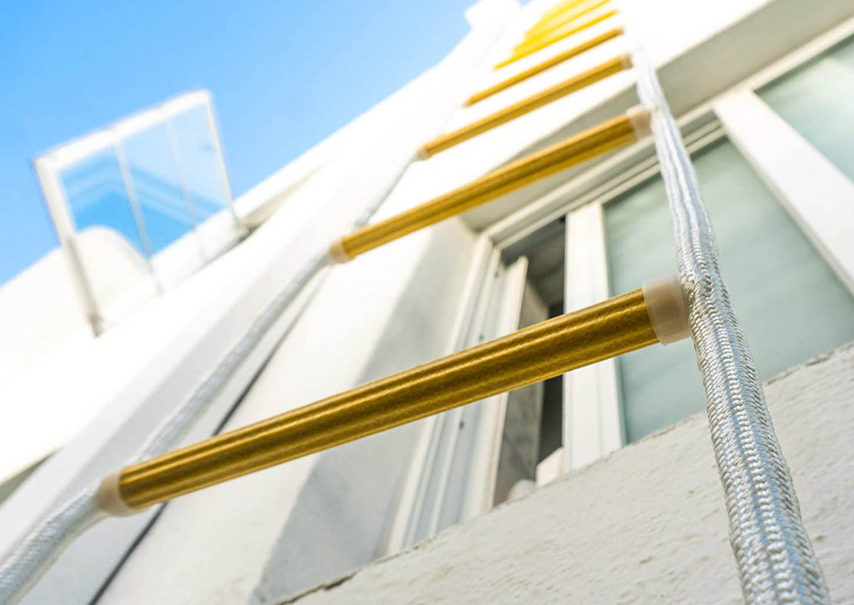 The Best Fire Escape Ladder hanging out of a window and extending several stories down.