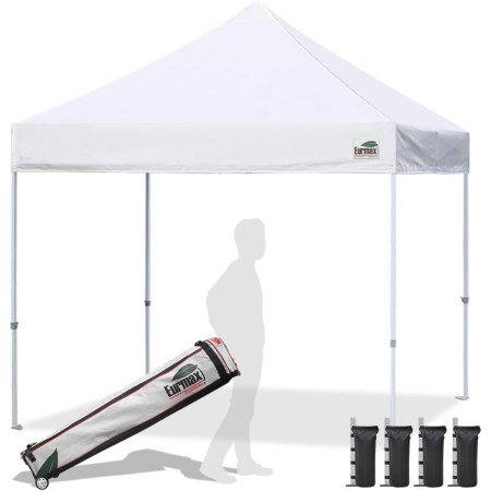  Eurmax 10x10 Standard Canopy Tent with the silhouette of a person holding the carry case