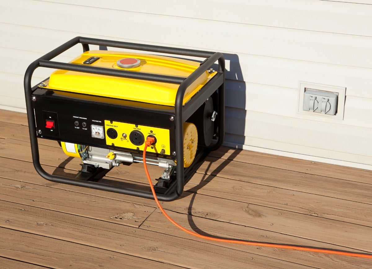 A bright yellow and black emergency backup generator.