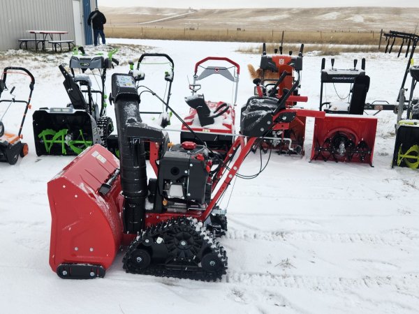 layout of the best snow blower options outside in a snowy setting