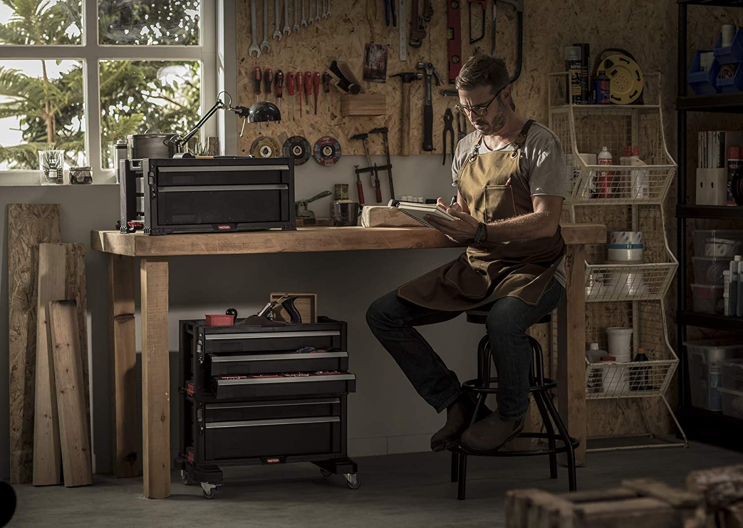 The best rolling tool box option wheeled into place under a workbench