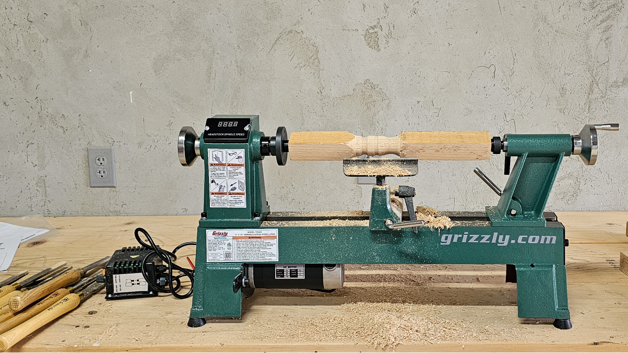 Image of Grizzly Lathe with wood stock on wood workbench