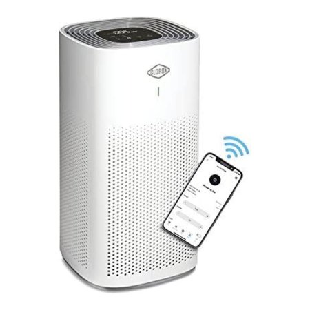  The Clorox Alexa Smart Medium Room True HEPA Air Purifier and a phone showing it communicating with the Clorox mobile app via WiFi.