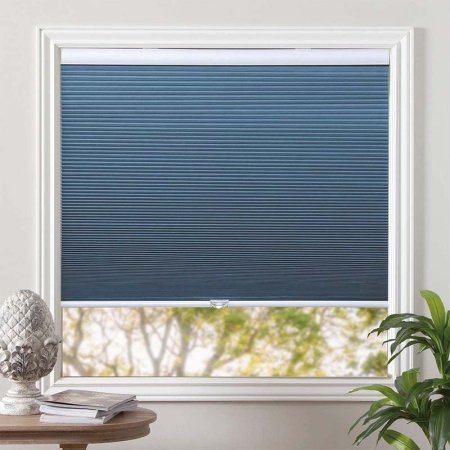  The Grandekor Blackout Cellular Shades in blue covering a window.