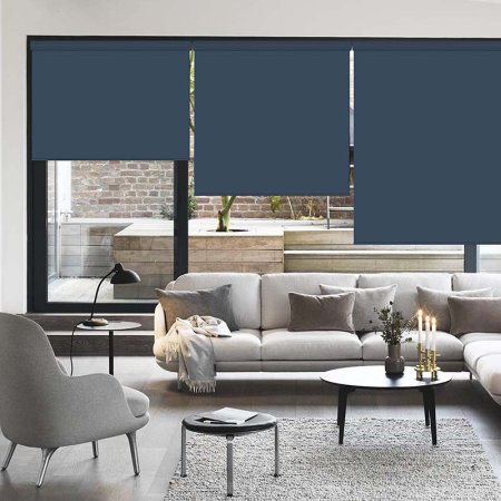  The Passenger Pigeon Valanced Blackout Cordless Shades installed on living room windows to provide privacy from an outdoor space.